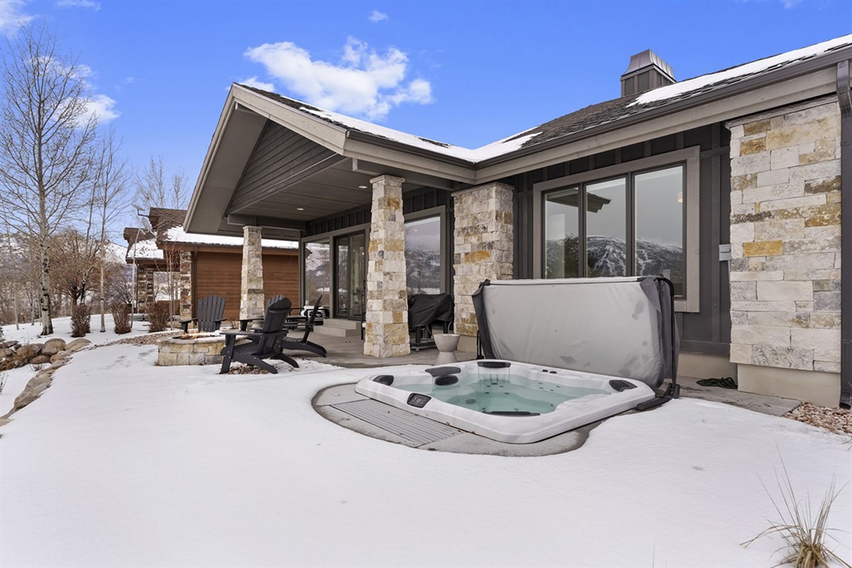 Step outside to your private patio and hot tub—soak under the open sky with mountain views all around.
