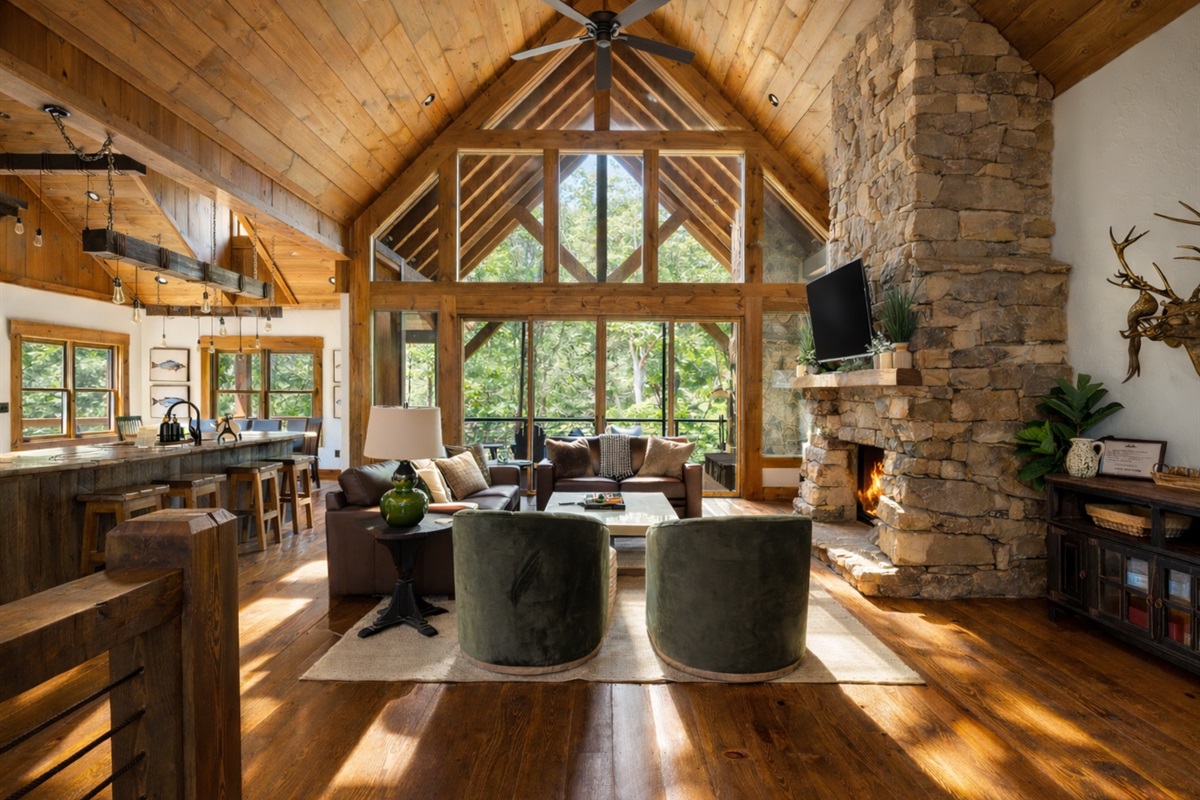 The soaring ceilings, large windows, and rustic touches create a bright and welcoming space for relaxation and connection.