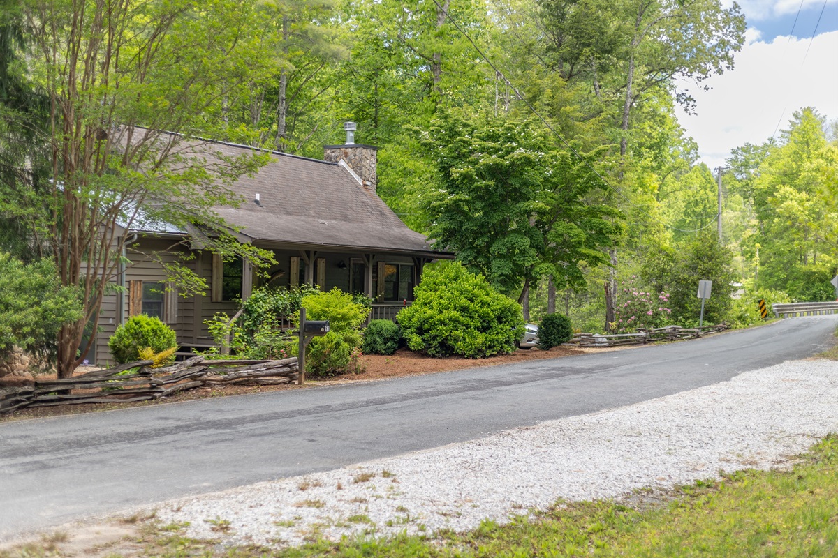Additional parking is located across the street, offering extra room for multiple vehicles, trailers, or guests traveling together.