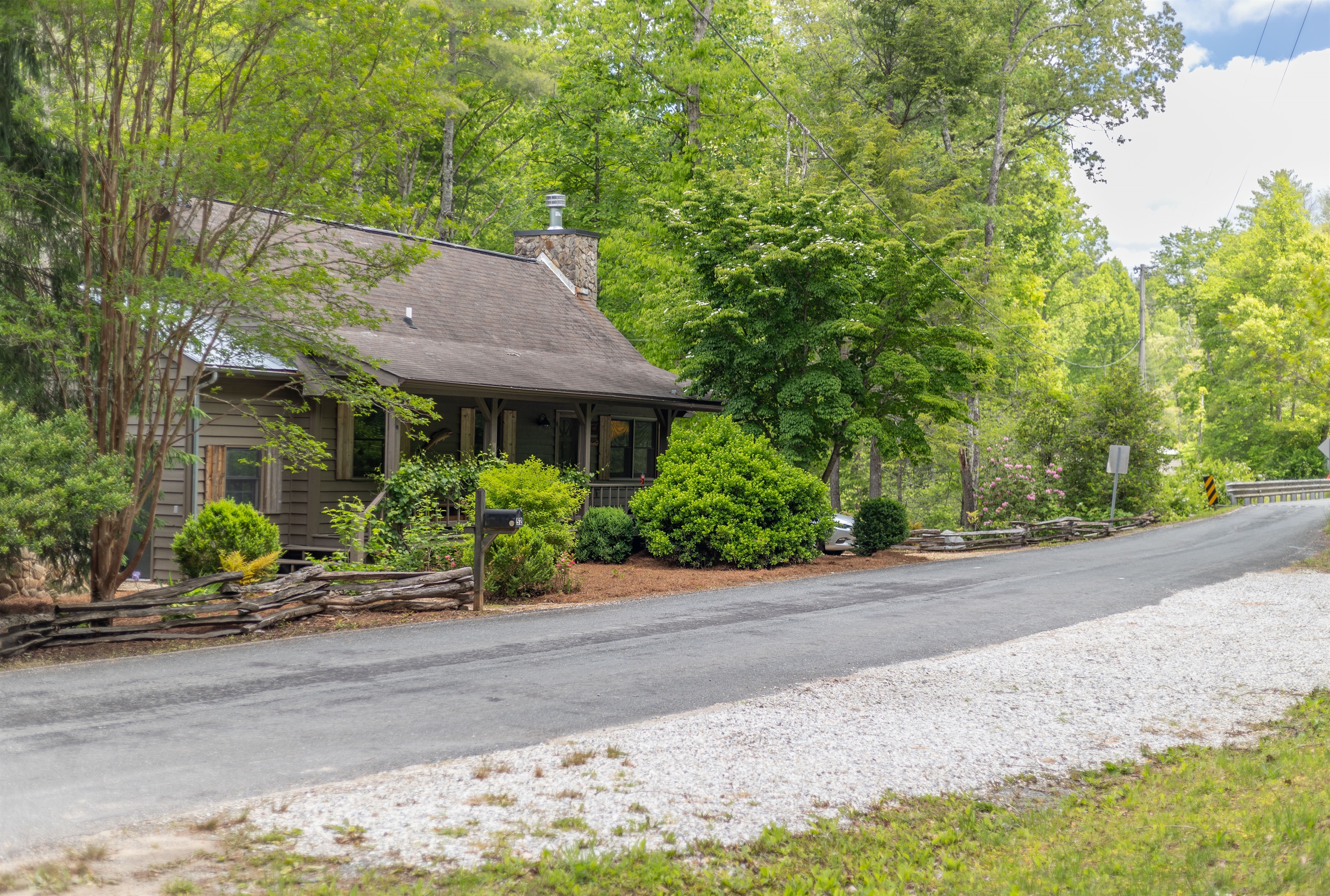 Additional parking is located across the street, offering extra room for multiple vehicles, trailers, or guests traveling together.