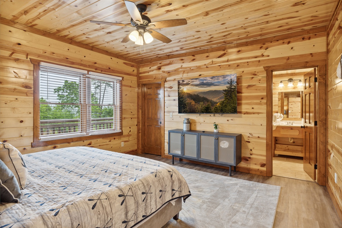King bedroom with TV and full ensuite bathroom.