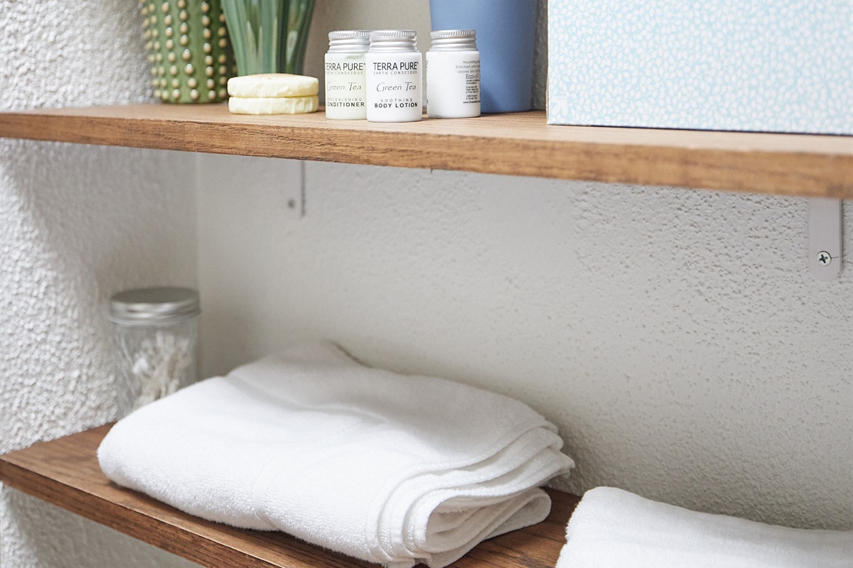 Body lotion, Q-tips, and cotton pads provided