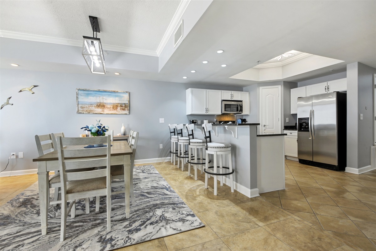 Kitchen and dining. Dining table seats 6. Bar top seats 4.