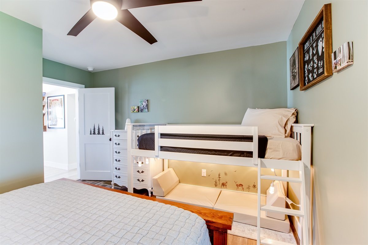 Bedroom 2 (into the forest): queen bed, loft twin + fun reading nook under the loft!