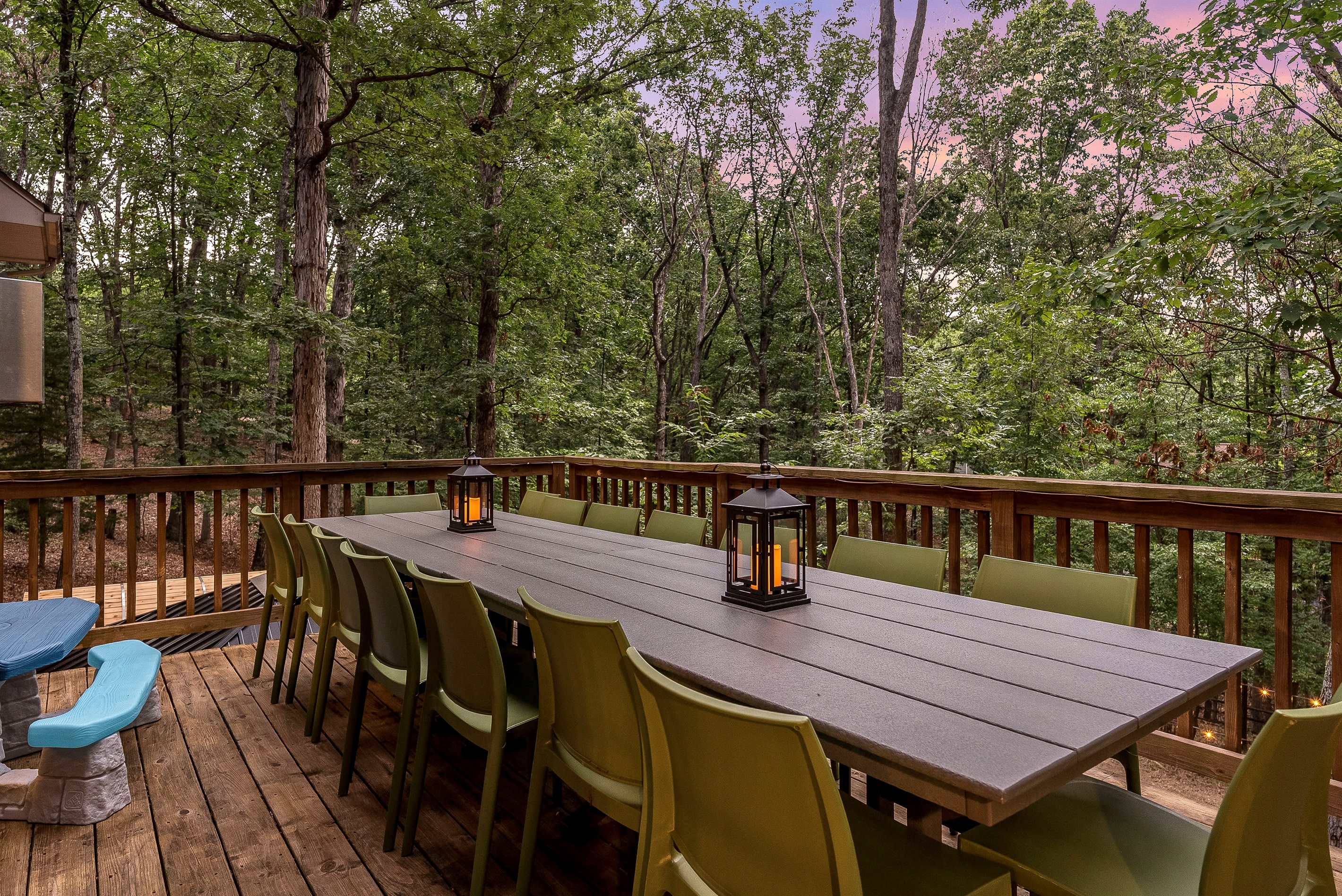 Outdoor dining for the whole crew — lantern-lit dinners in the trees
