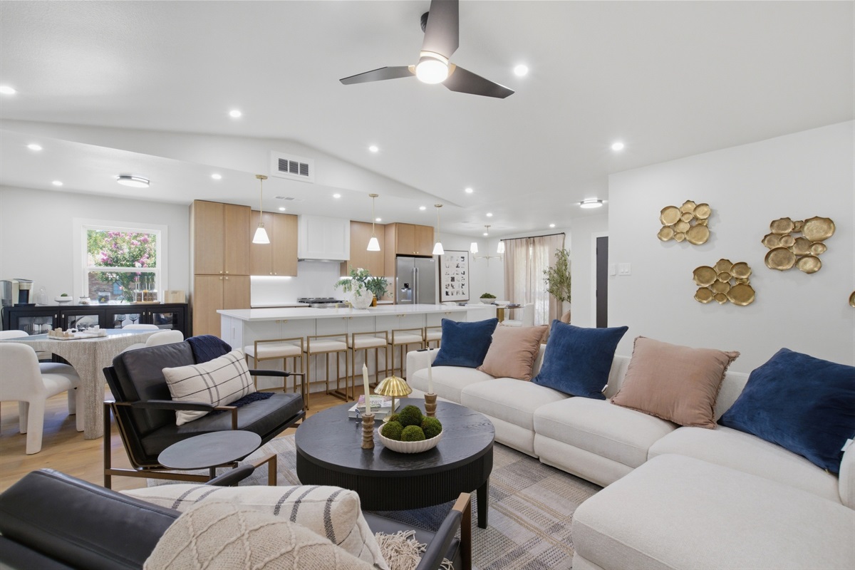 Open-Concept Layout connects the living room, kitchen, and dining area into one bright, vaulted space. Built for entertaining groups and families.