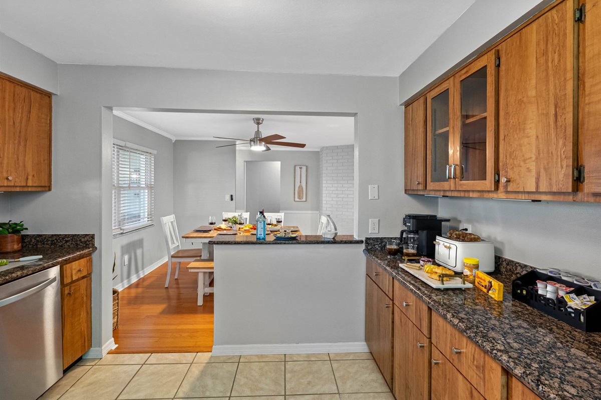 Gather, dine, and connect in this coastal-chic dining space with seating for six and easy flow to the kitchen.