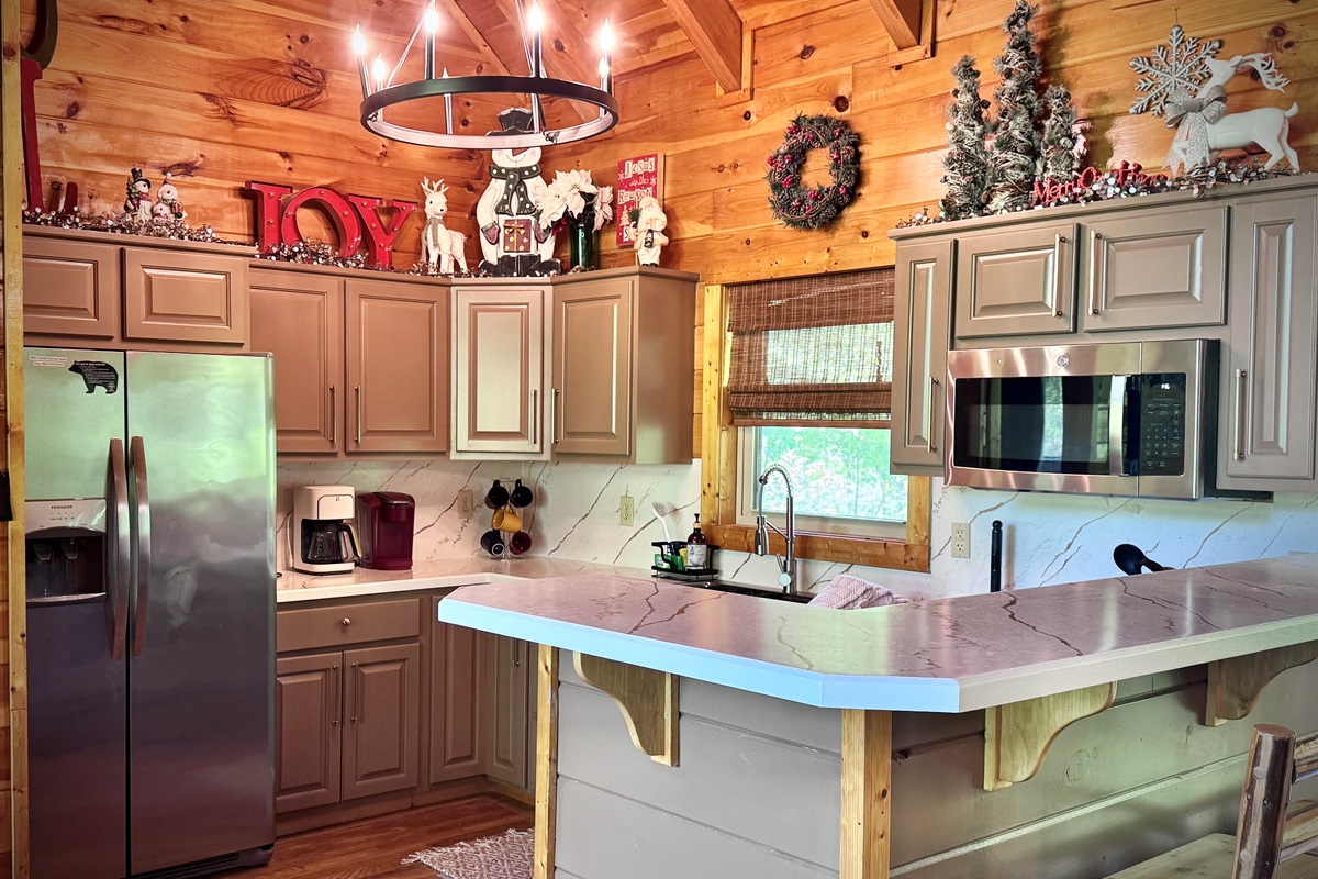 Kitchen - freshly updated!  Beautiful new cabinet color, new counters, new lighting, new dishwasher and new blinds!