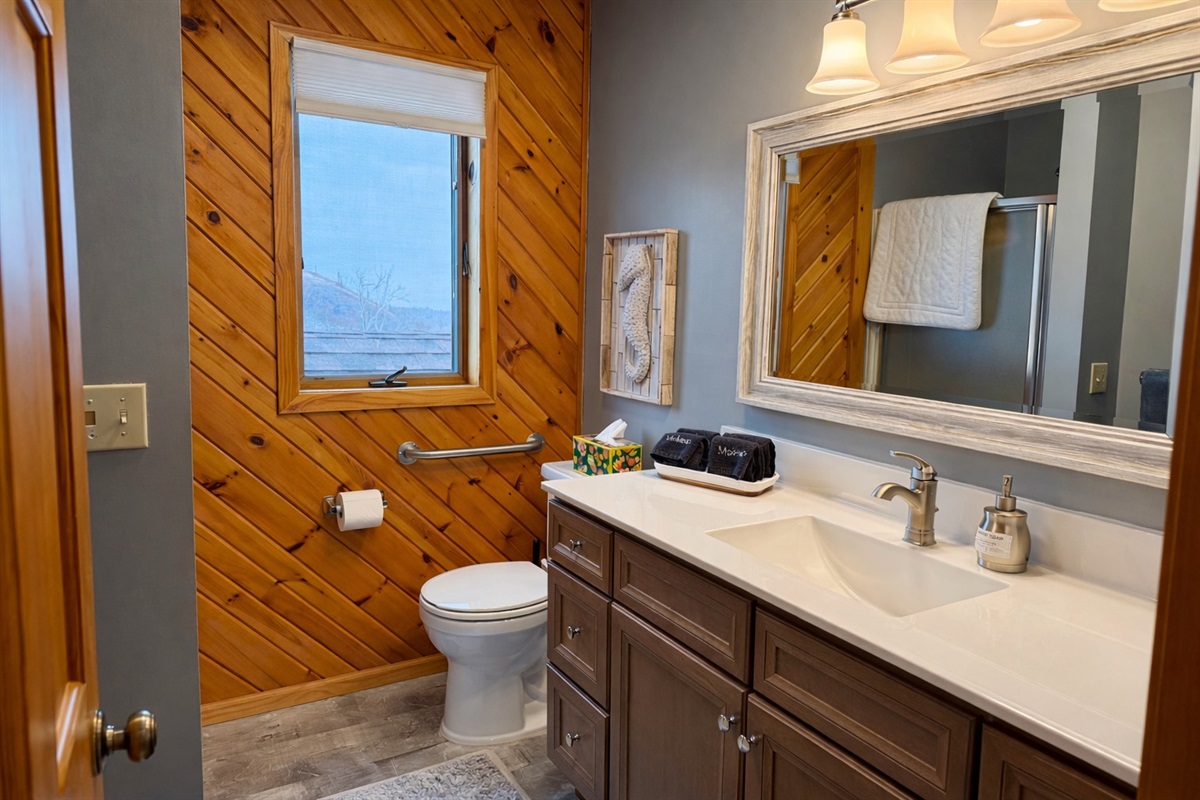 The main floor bathroom is bright, open, and beautifully updated, clean lines, fresh finishes, and plenty of light. A calm, modern space to refresh and recharge after a day exploring the North Shore.