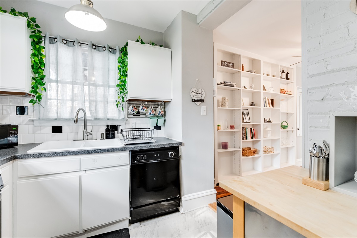Kitchen Delight: Natural light dances through the windows, highlighting modern charm and stylish decor!