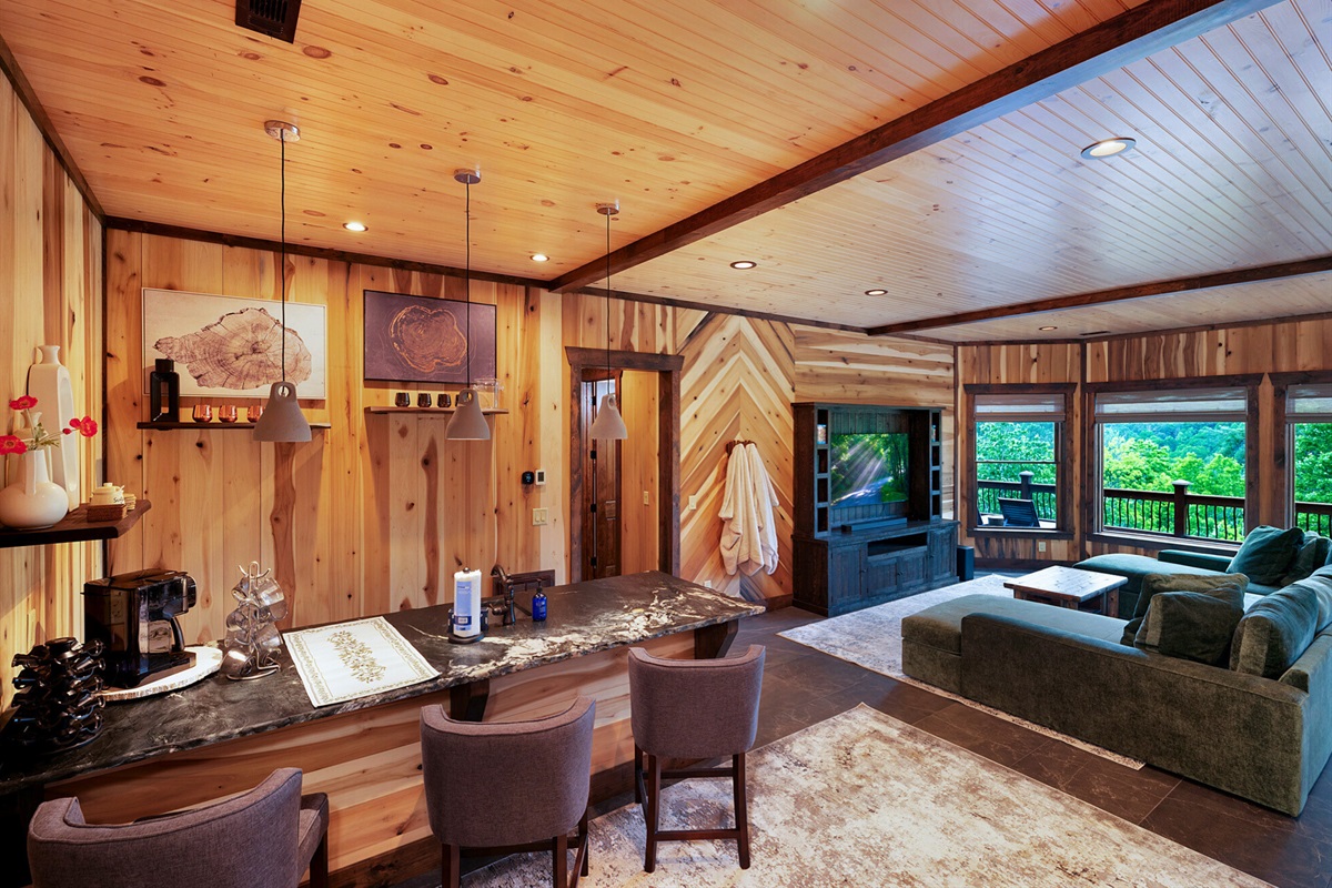 Kick back in the bar and lounge area, perfect for a casual evening drink or game night with friends.