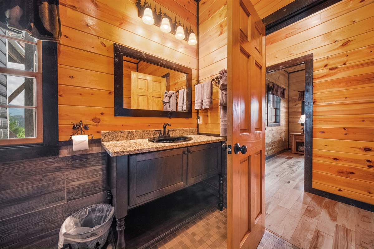 The back bedroom on the first floor is directly across from the big bathroom. This is perfect for young guest and guests with special bathroom needs.