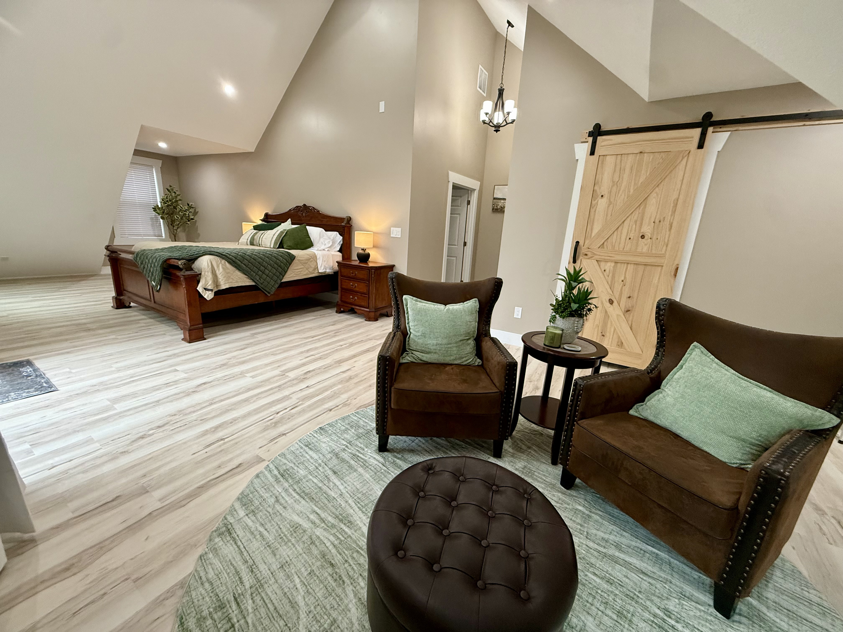 Master bedroom suite with seating area