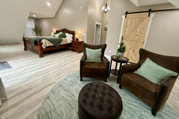 Master bedroom suite with seating area