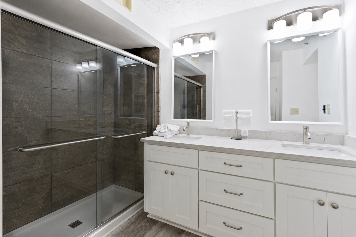 The Ensuite Bathroom, recently renovated with sliding glass walk in shower, connected to Primary Bedroom