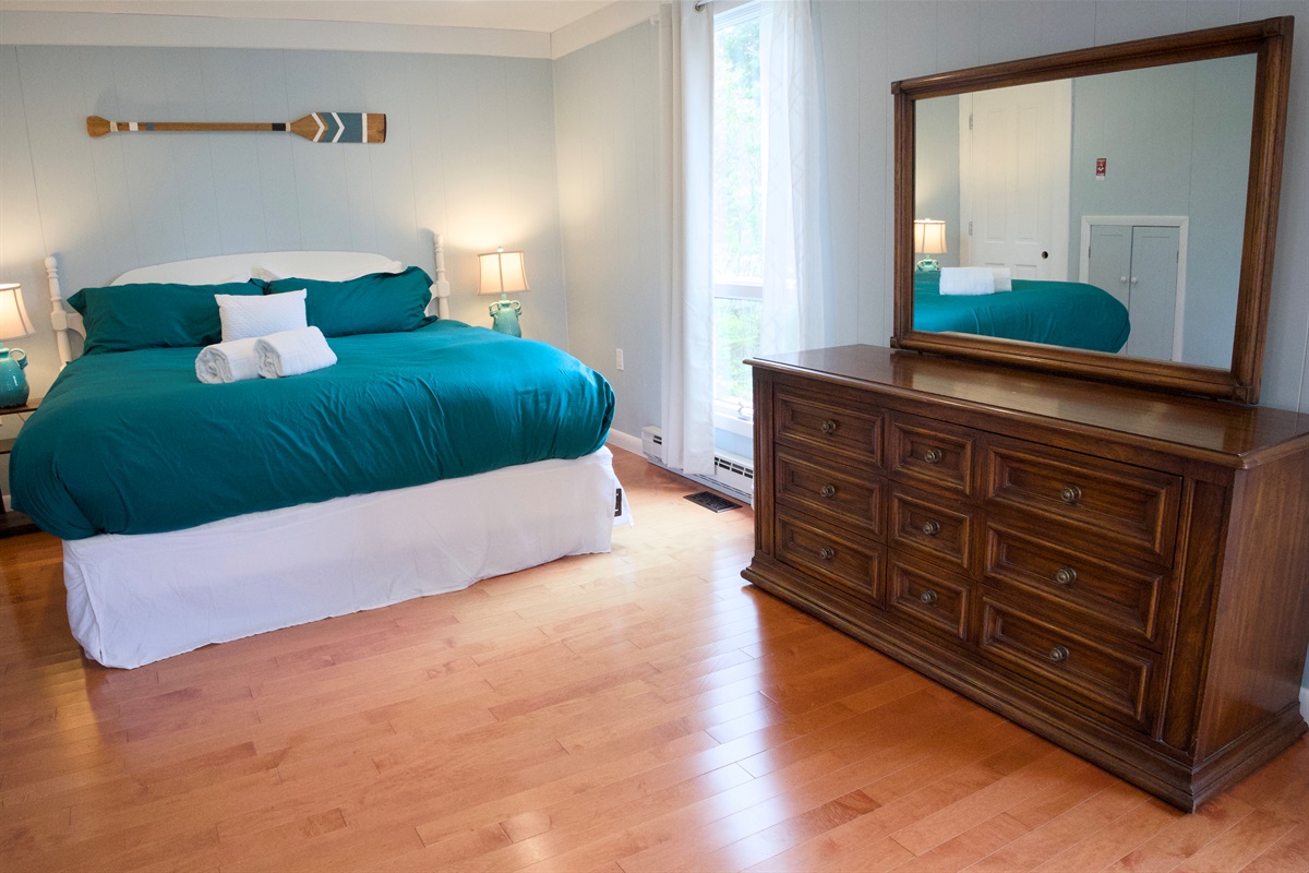 Comfortable King Bedroom with lots of windows and light, on the main floor