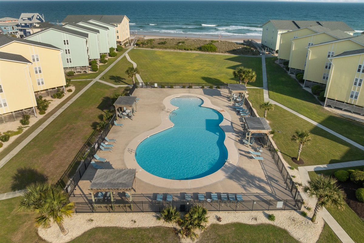 Resort-style seasonal pool just steps from the beach with ocean views