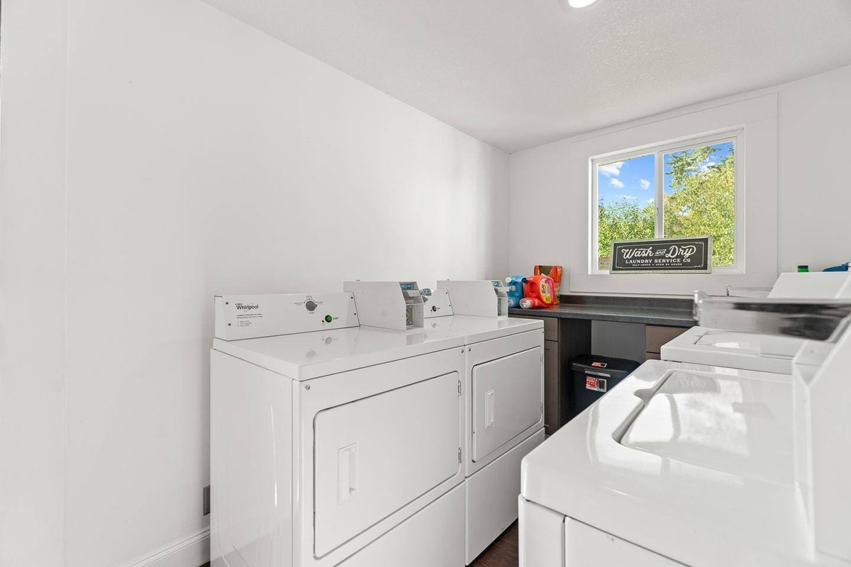 Convenient laundry room equipped with coin-operated machines, making it easy to keep your clothes fresh during your stay.