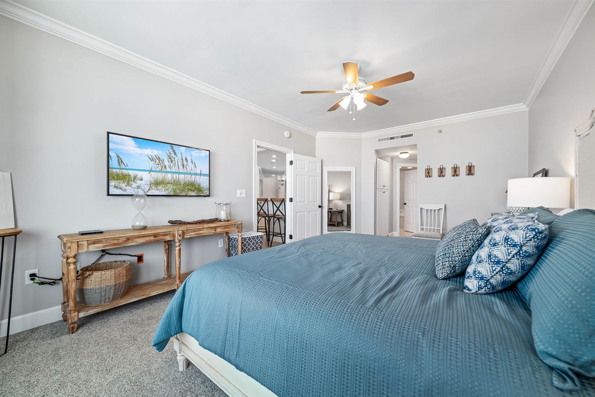 Escape to tranquility in this beautifully appointed bedroom, where the soothing sounds of the ocean are just beyond the balcony.