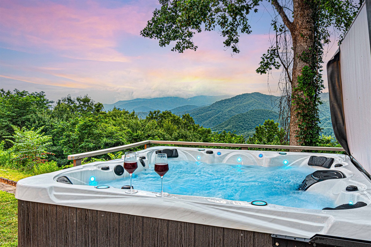 Unwind in your private hot tub with stunning mountain views at sunset!