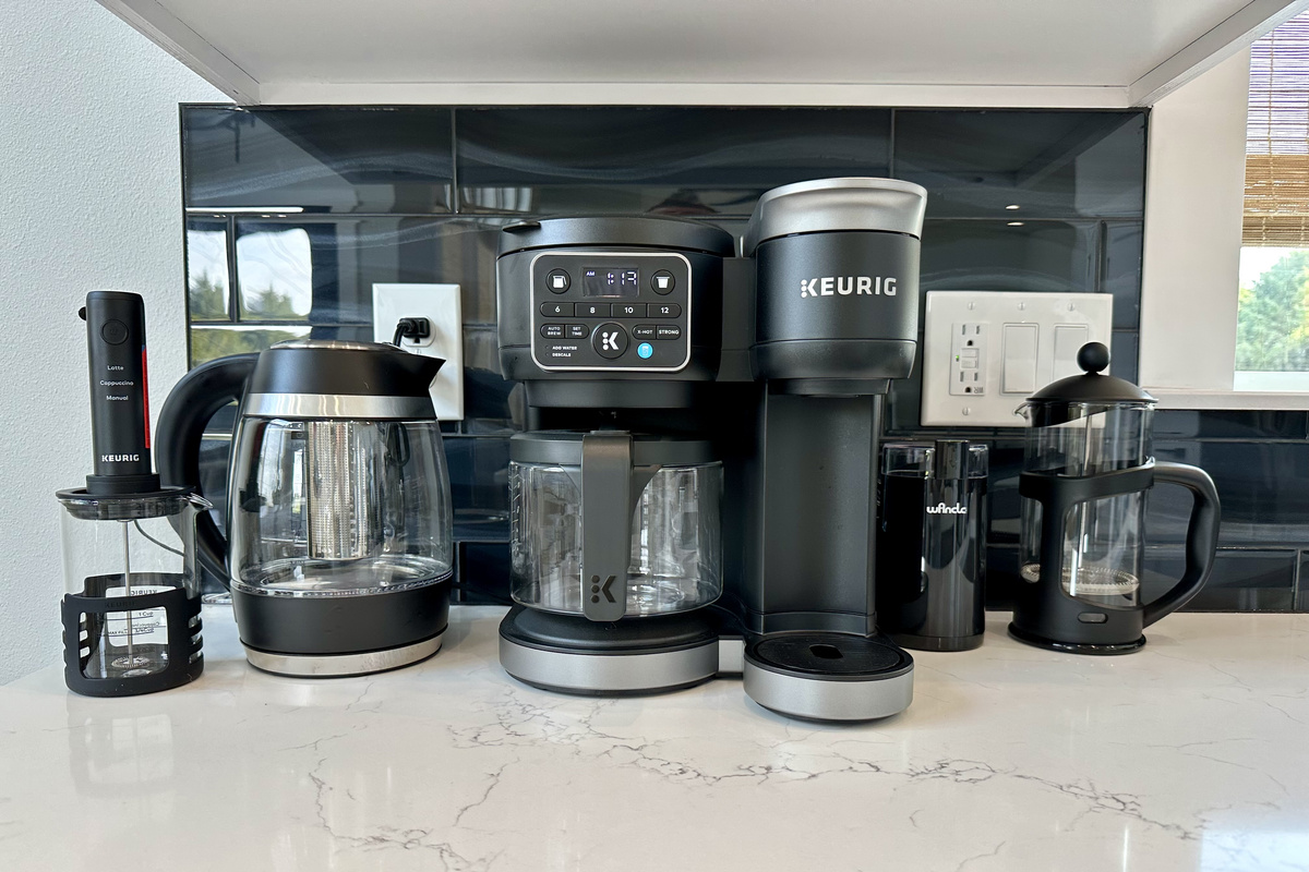 Keurig, drip carafe, French press and an electric kettle — the coffee bar is up before you are.