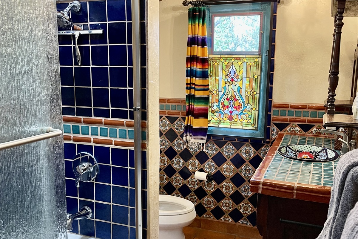 Immerse yourself in the vibrant colors and patterns of this Mexican-inspired bathroom.