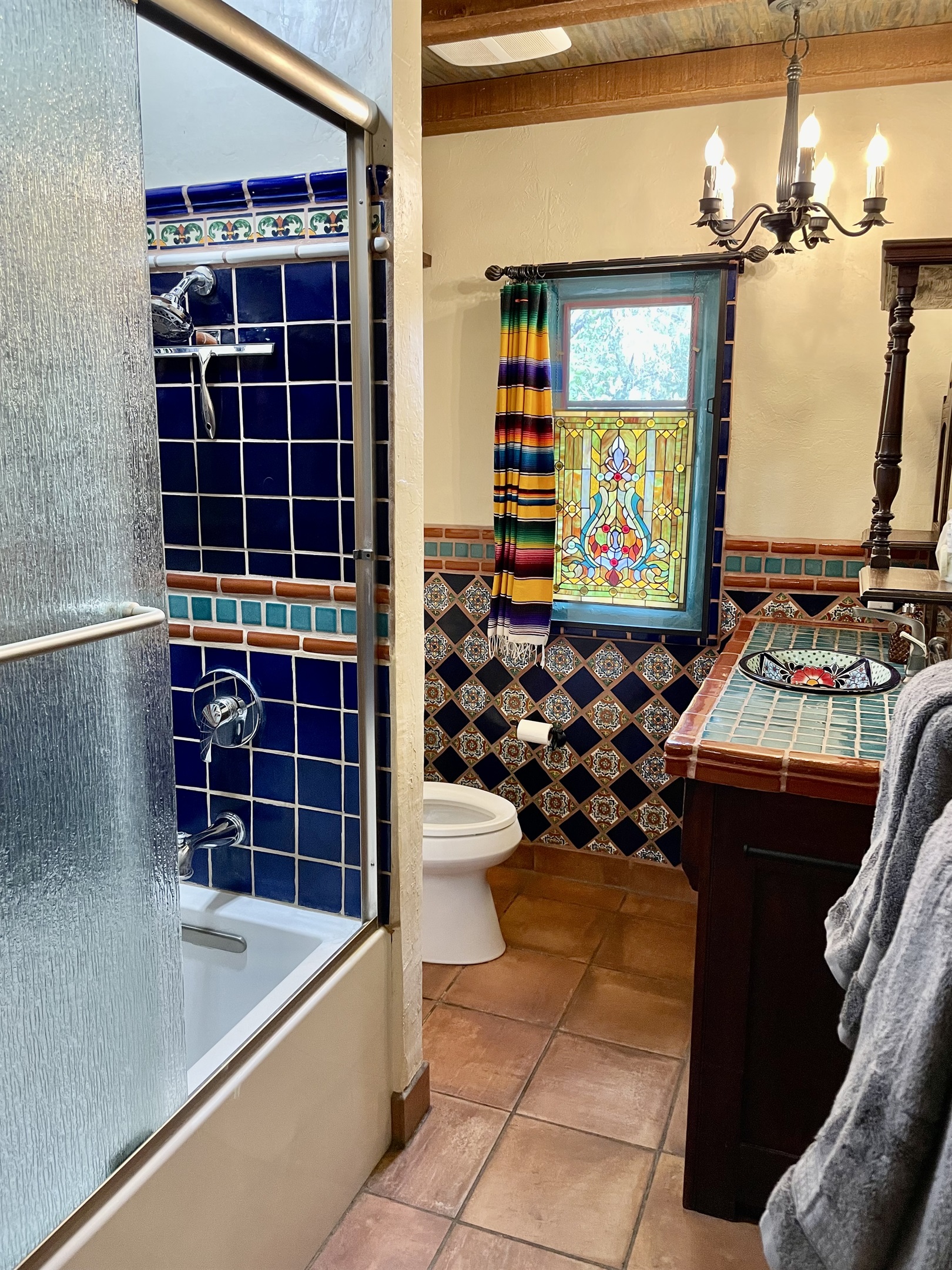 Immerse yourself in the vibrant colors and patterns of this Mexican-inspired bathroom.