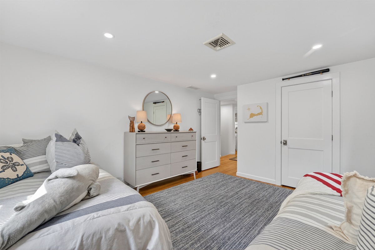 A warm and roomy fourth bedroom featuring twin double beds for extra comfort!