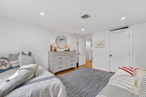 A warm and roomy fourth bedroom featuring twin double beds for extra comfort!
