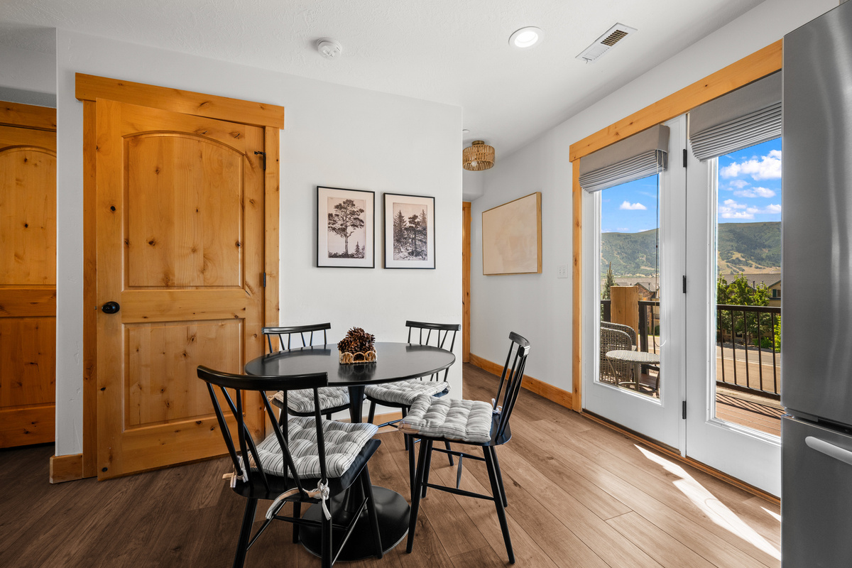 The kitchen flows naturally into the dining and outdoor areas for effortless group gatherings.