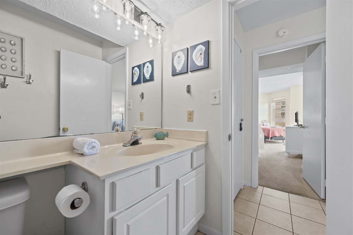 Clean and functional vanity area with ample counter space