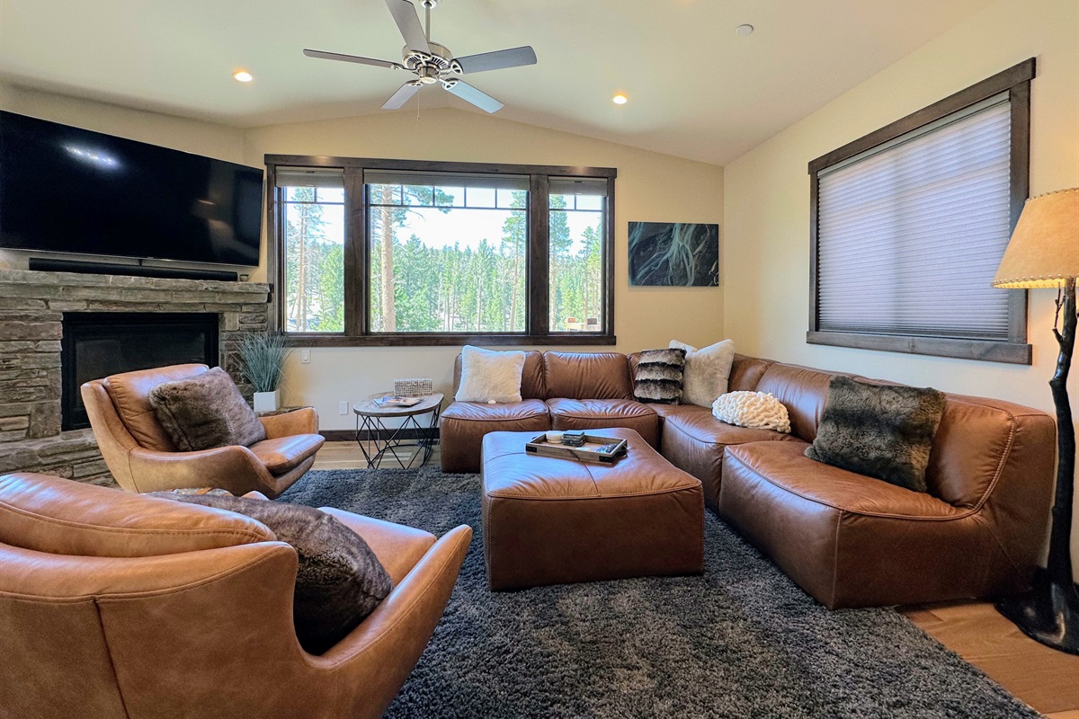 Lounge in style with leather seating, a crackling fire, and jaw-dropping 180° mountain views.