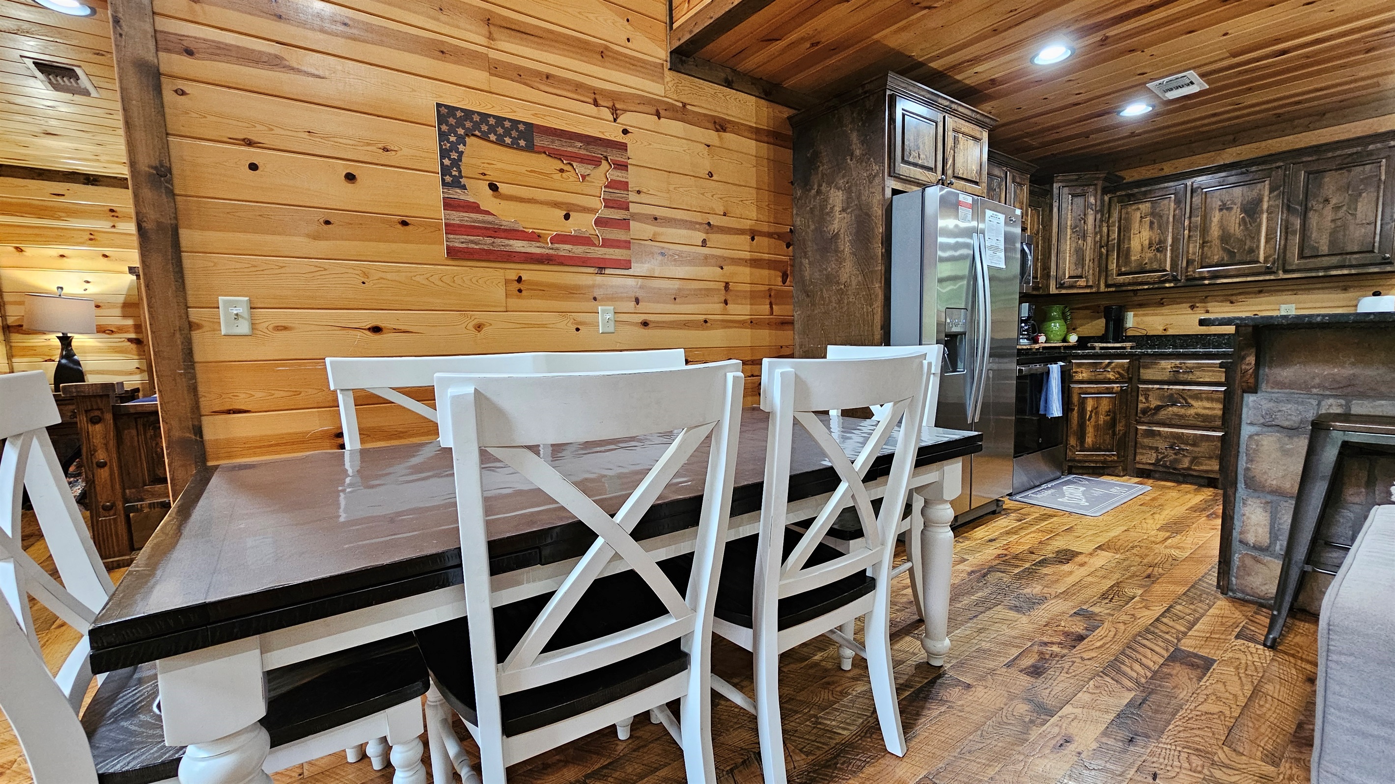 Gather here—rustic charm meets modern amenities in this inviting kitchen-dining space.