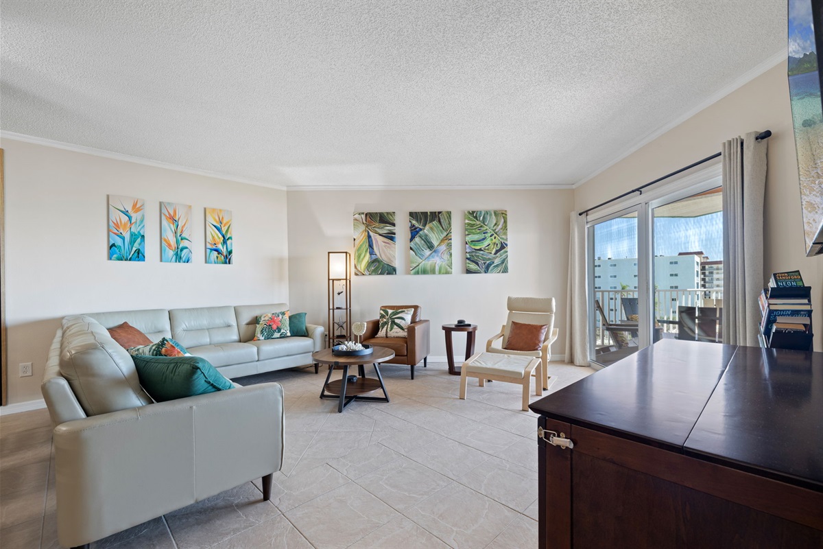 Living room open to the dining and kitchen area with gulf views (murphy bed sleeps 2).