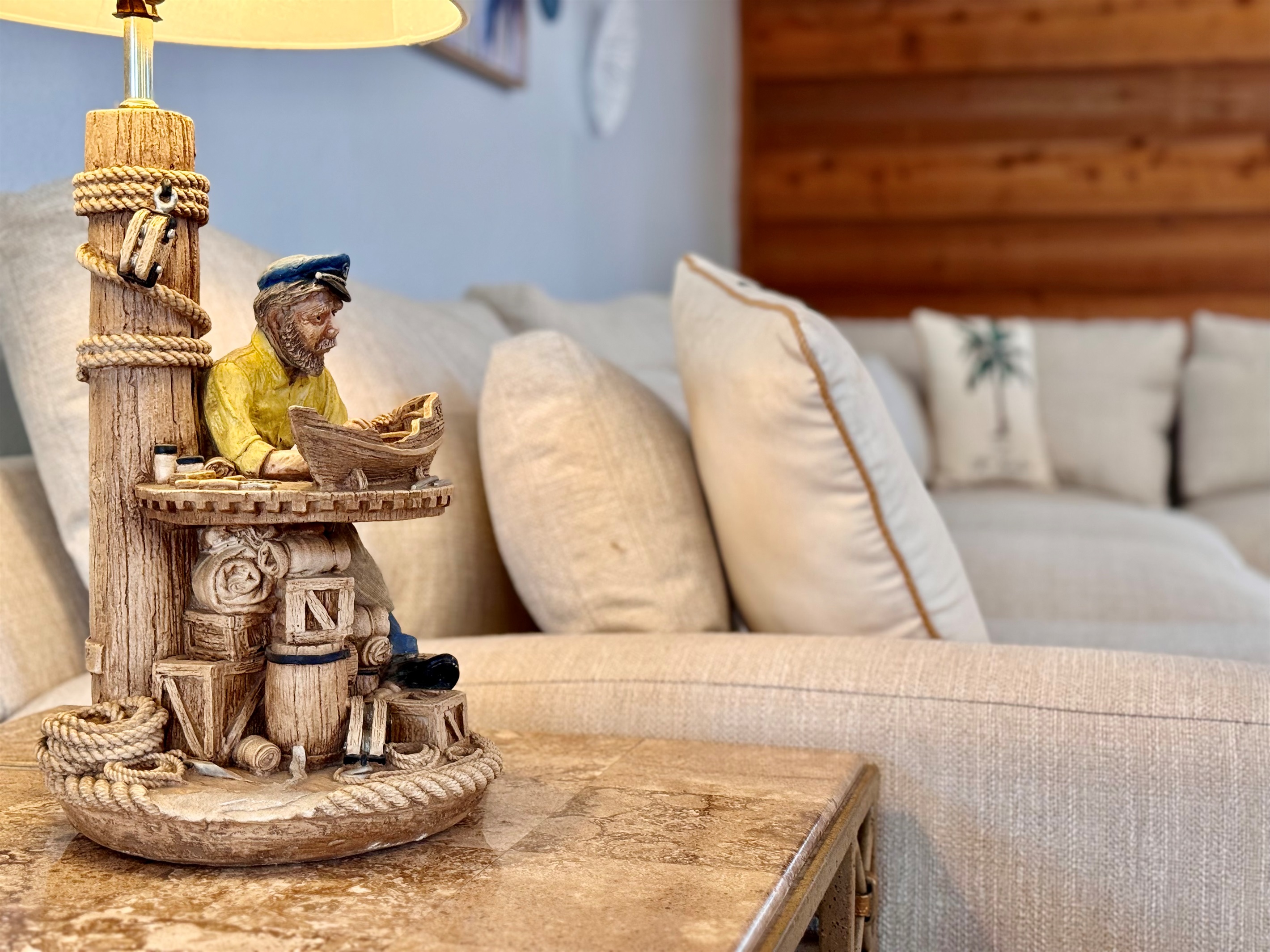 Accented with tropical throw pillows and extra-deep seating, it's perfect for mid-day naps, family lounging, or curling up with a book and a breeze.