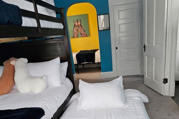 Sleep up to 6 in the pull out twin trundle bed, full over full bunk beds and twin bed in the Machu Picchu Bunk Room.