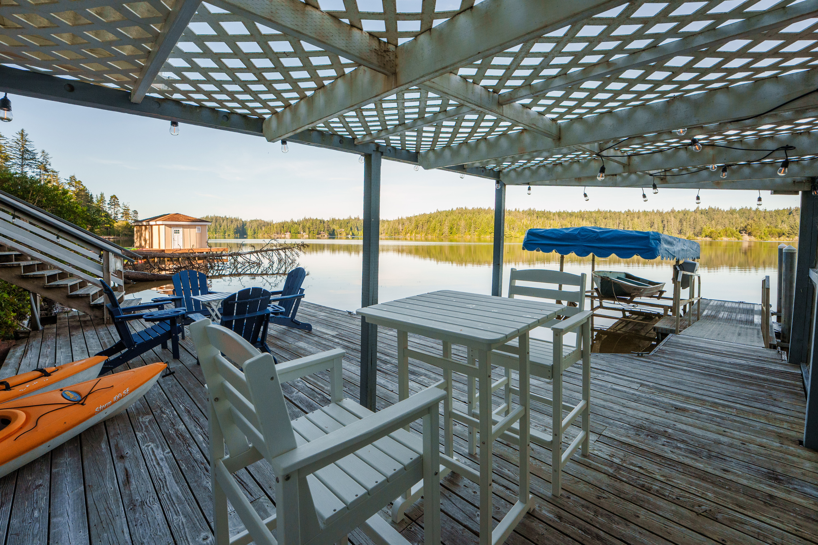 Four complimentary kayaks are ready at your private dock—just step outside, launch into Woahink Lake, and begin exploring the peaceful shoreline together.
