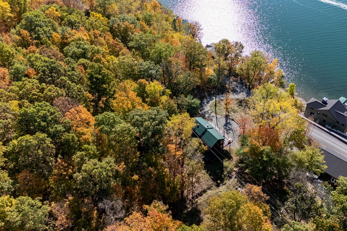Quiet lakeside access path, shaded by autumn trees, directly to Keuka’s clear waters.