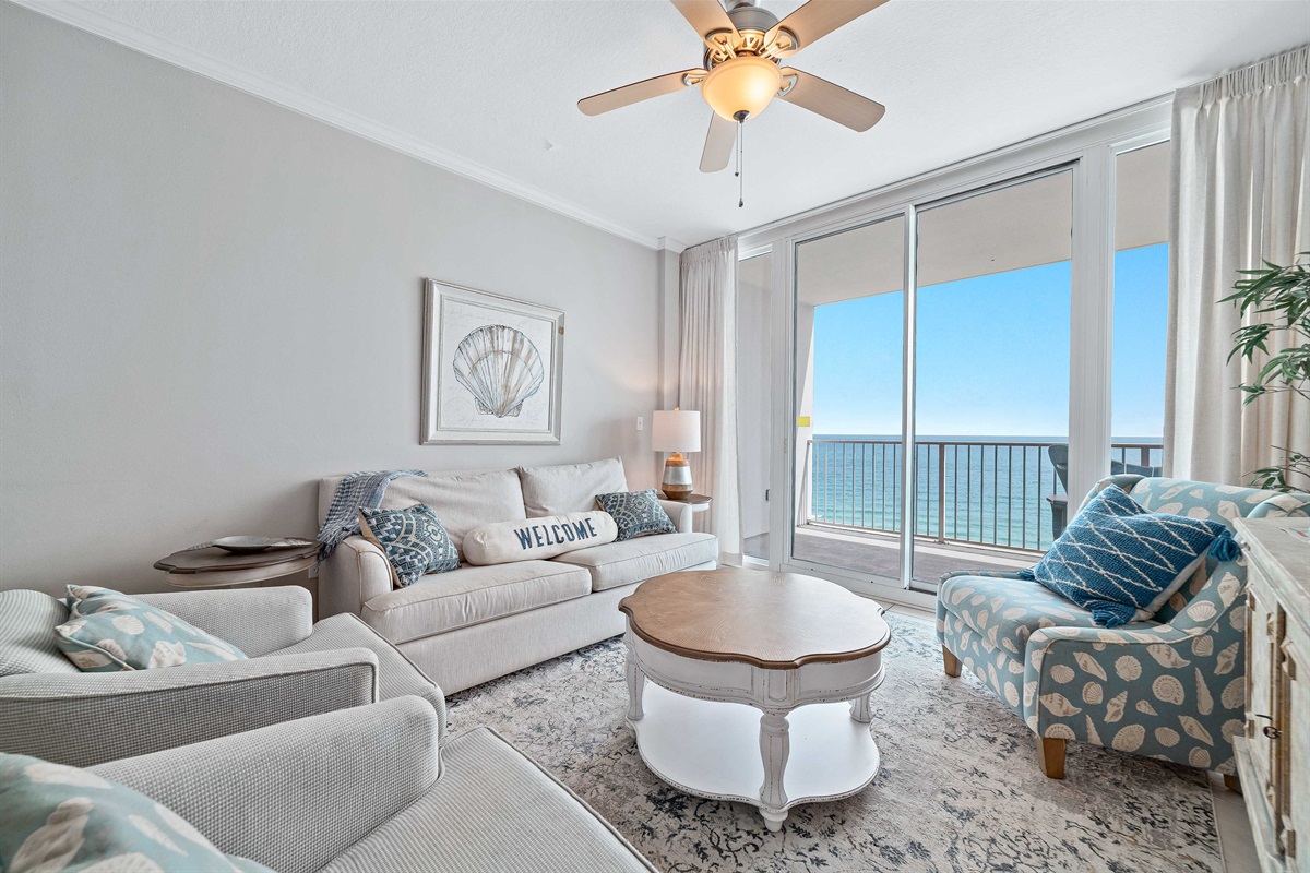 Maximize your comfort and sleeping arrangements with our versatile living area, showcasing a convenient sleeper sofa. Enjoy stunning panoramic ocean vistas right from your accommodation.
