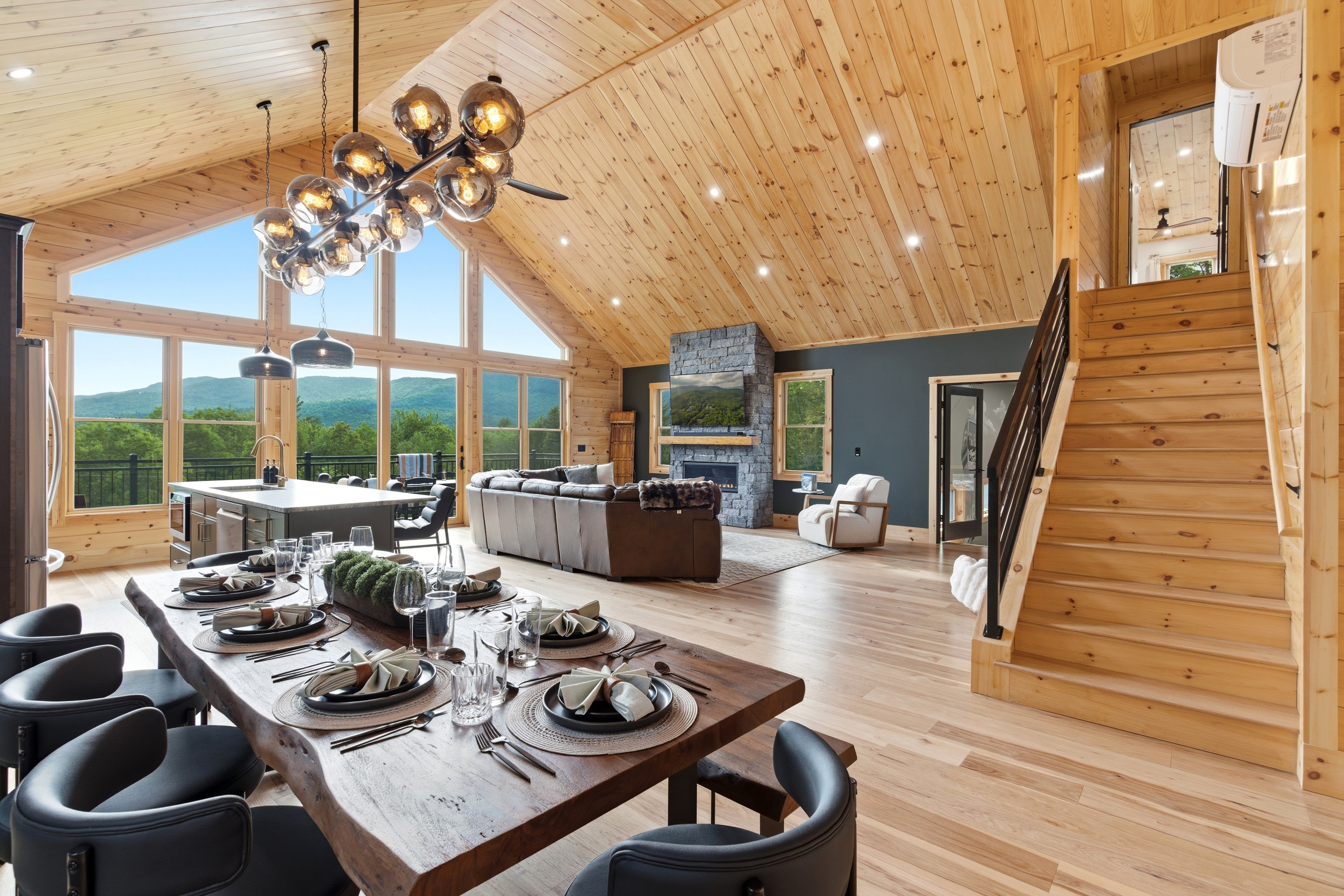 Relax in a living room with panoramic mountain views.