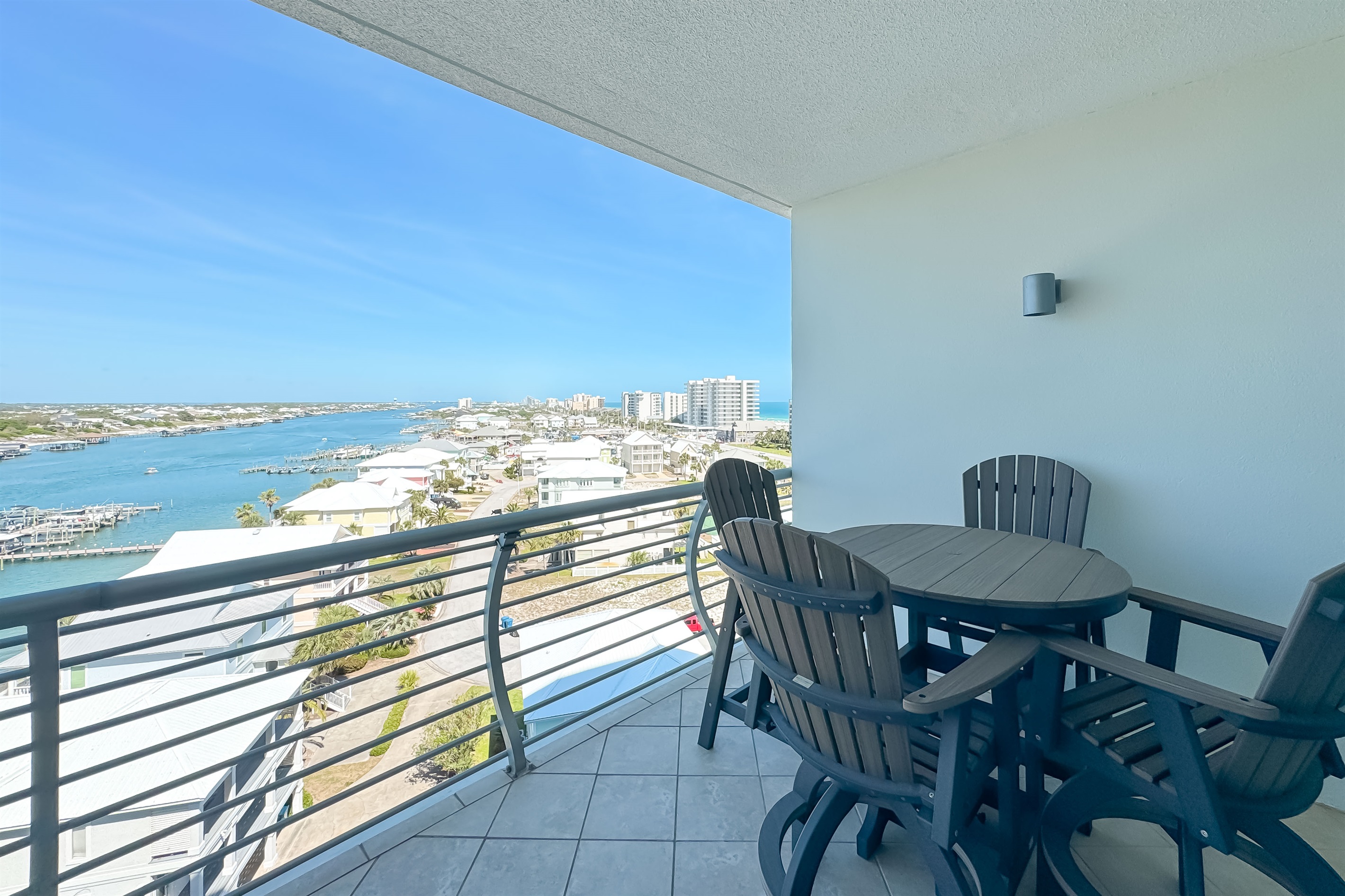 A stunning balcony view offering a glimpse of the serene waterfront. A perfect spot to relax and enjoy the scenery.