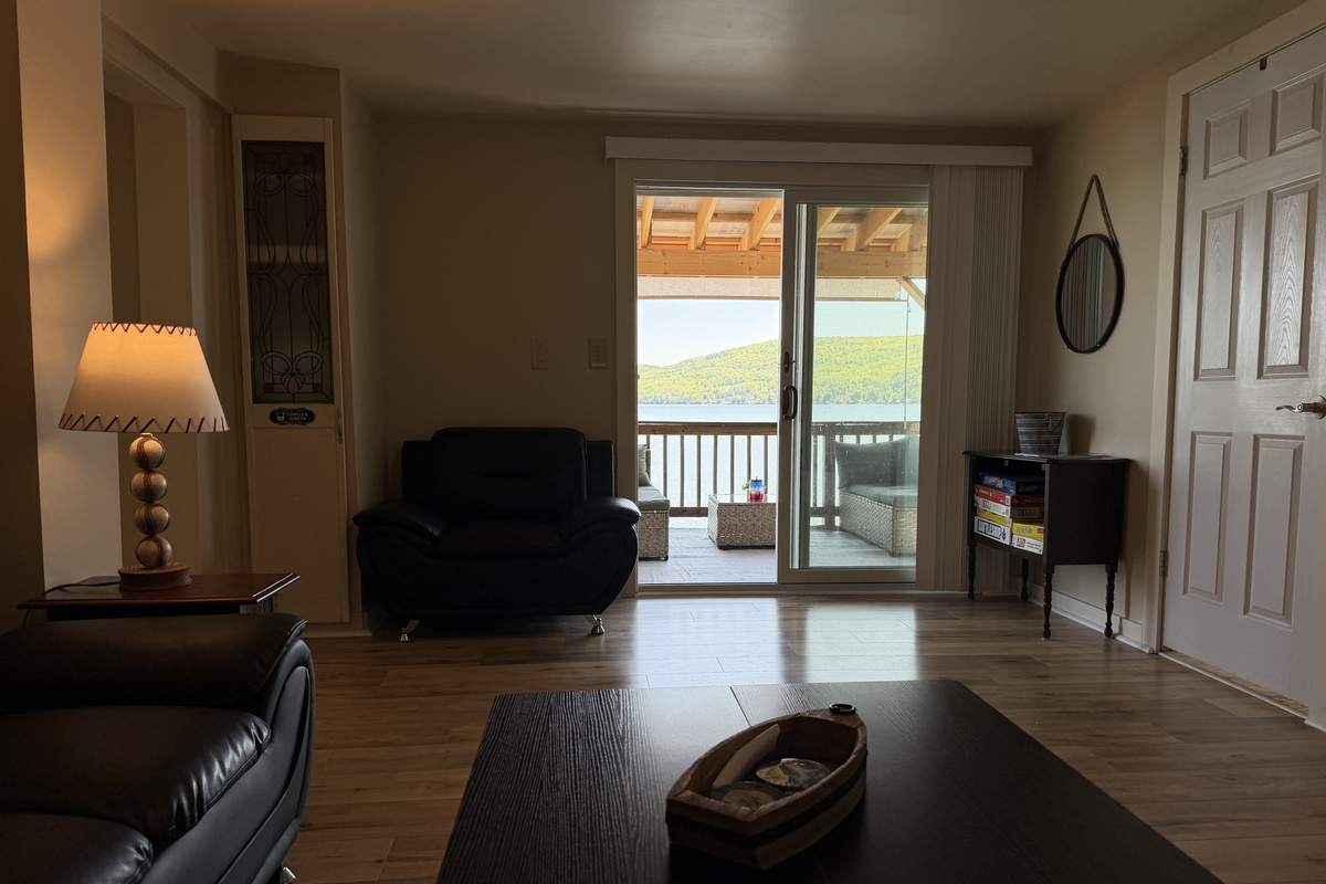 Den with a view of Canadarago Lake beyond