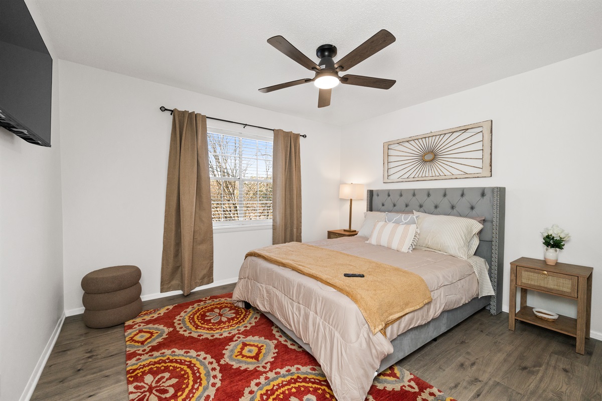 Comfy queen bedroom ready for binge watching your favorite show