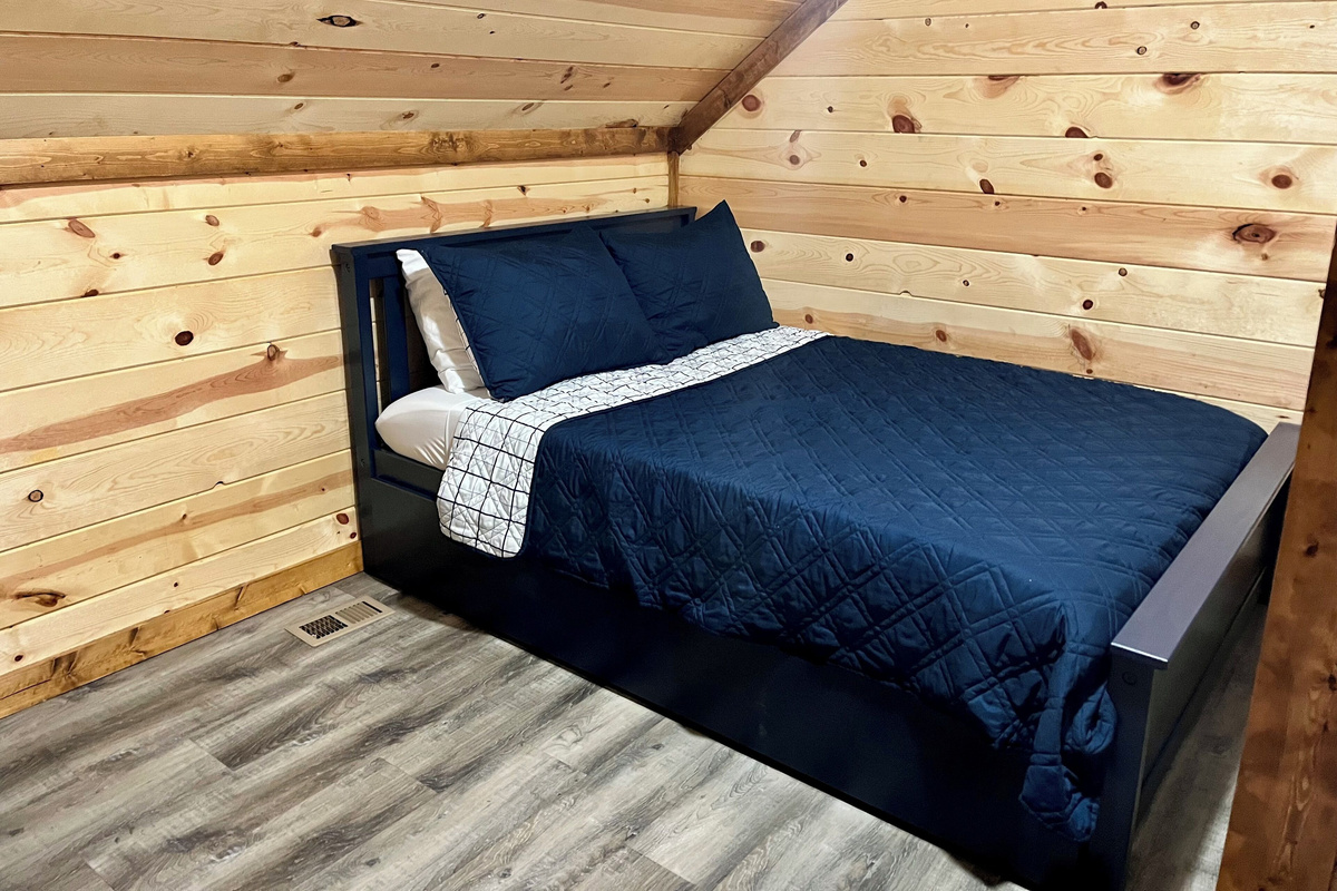Full size bed upstairs with trundle