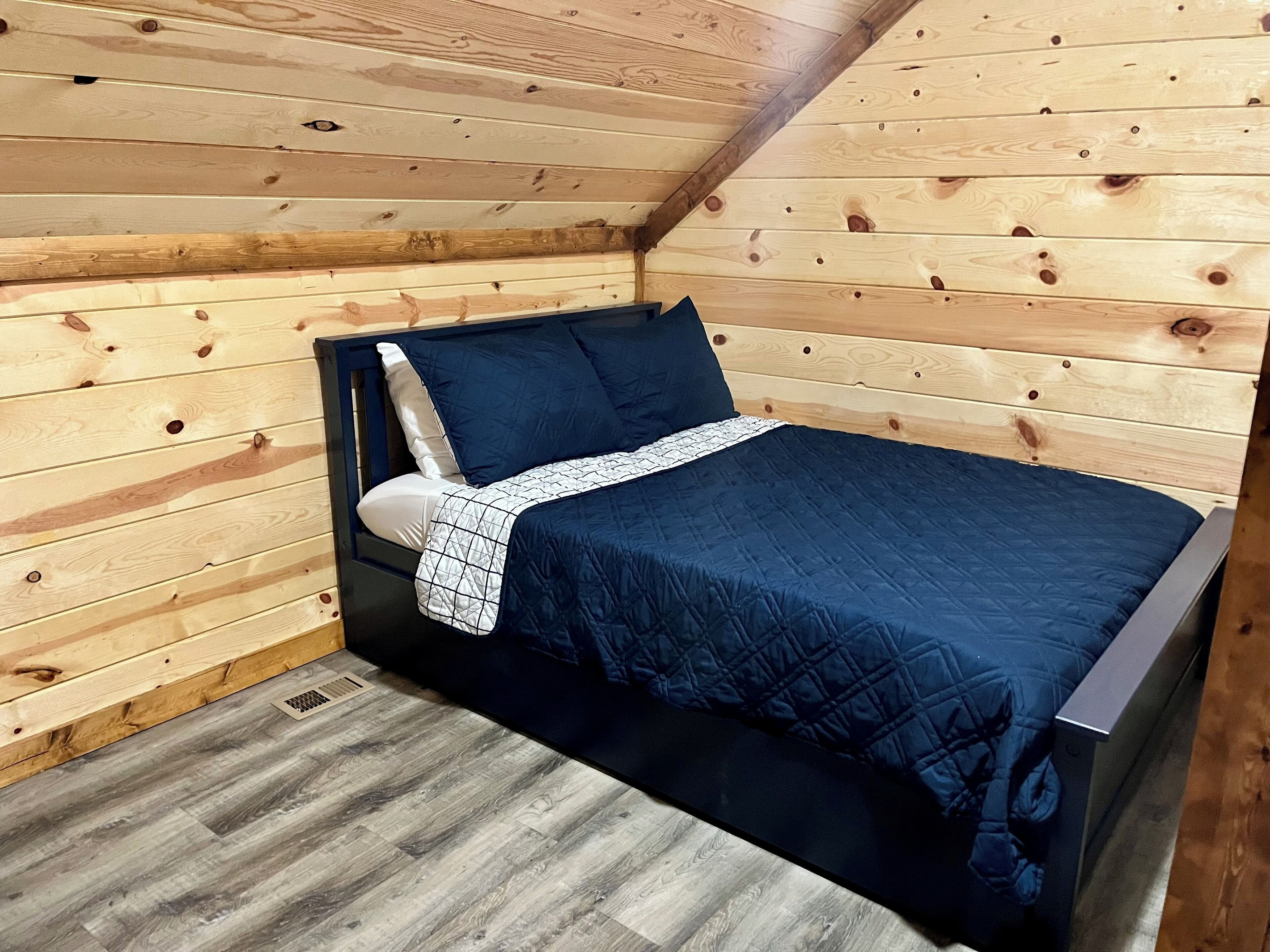 Full size bed upstairs with trundle
