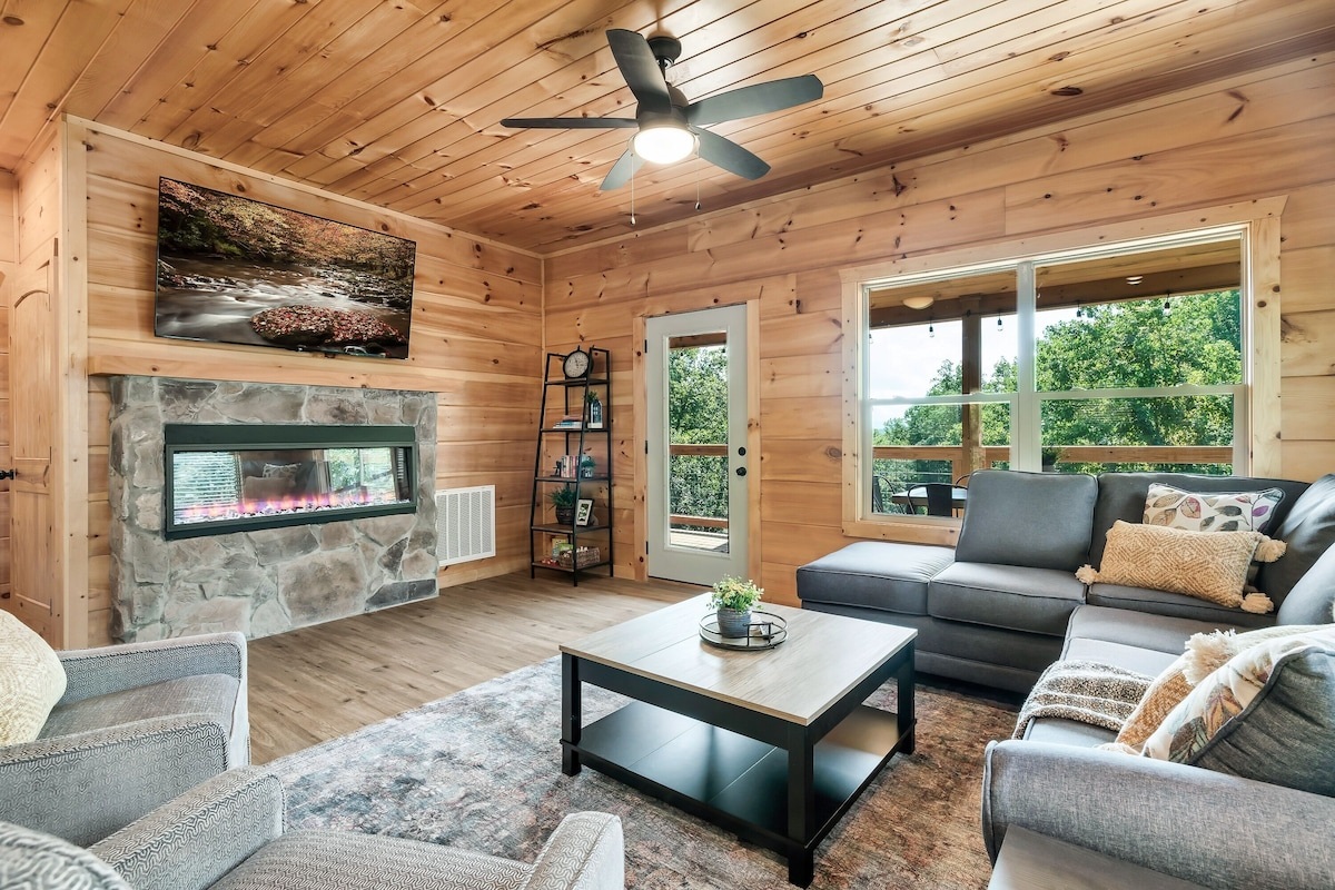 75" Smart TV for shows, movies, or sports. Cozy up with the electric fireplace.