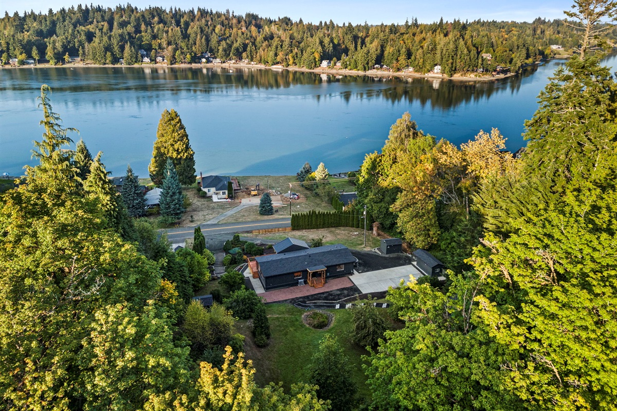 A stunning bird’s-eye view of the home nestled among expansive shorelines and tranquil waters