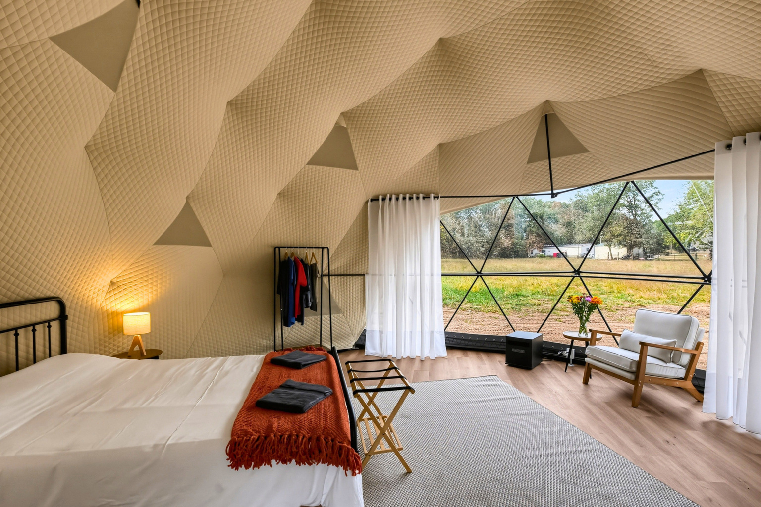 Settle into your queen bed, with a comfortable seat and clothing rack to make yourself at home.