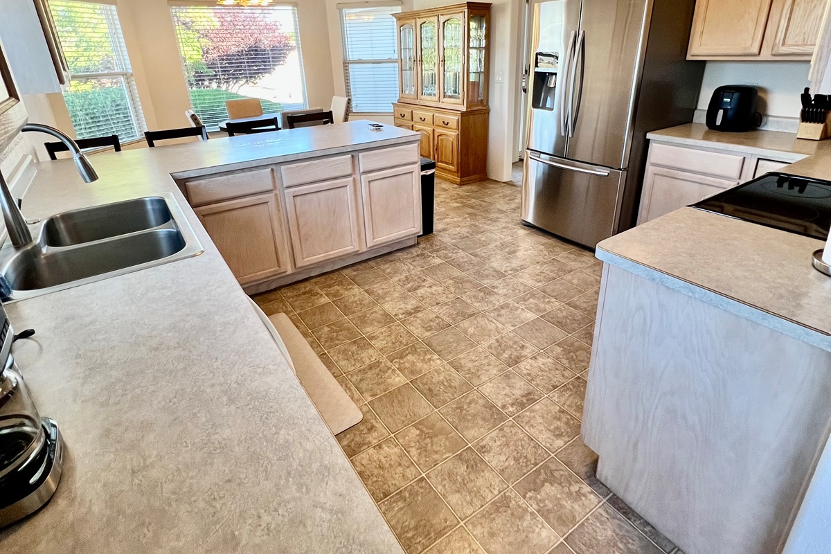 Cooking is a breeze in this fully equipped kitchen, featuring modern appliances and ample counter space.
