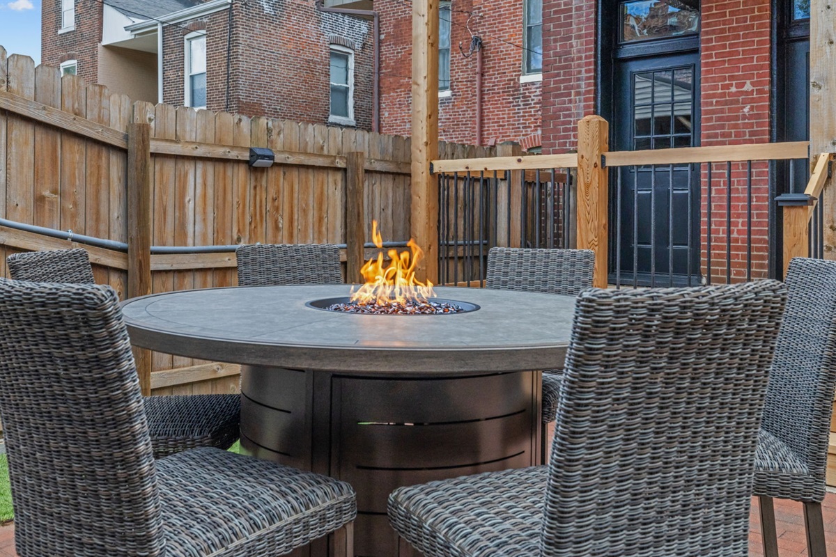 Share a meal around the outdoor dining table or gather round to keep warm with the center fire table feature.